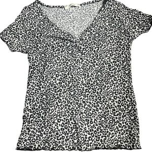 Black and white leopard print top with a V neck and short sleeves